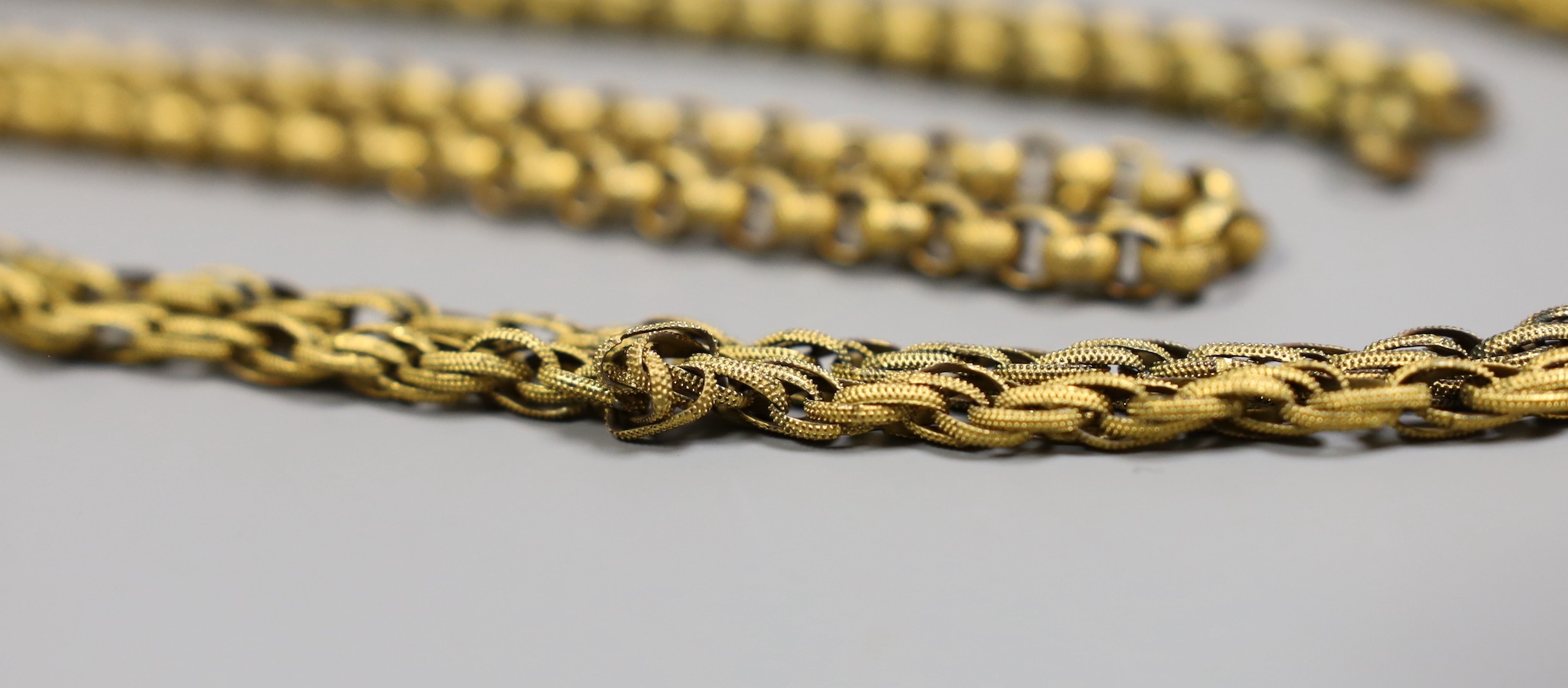 Two 19th century pinchbeck guard chains, longest 118 cm(a.f.)